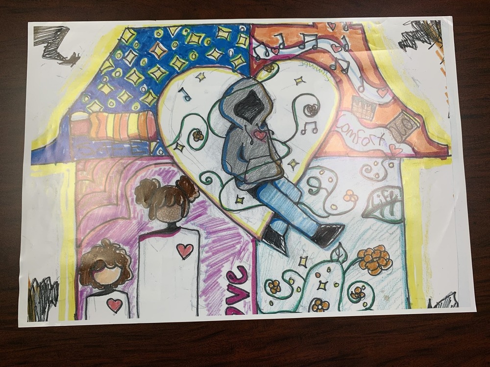 Winning drawing showing a person wearing a hoodie, surrounded by music notes and other things that in their home. 