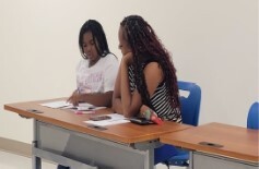 female student seated with a female tutor.