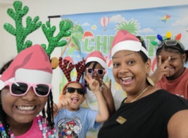 Happy smiling people at the christmas in july event.
