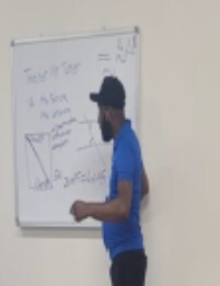Man at the whiteboard doing some tutoring.