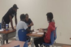 Students with a male teacher.