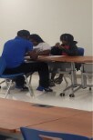 Tutor with two students.