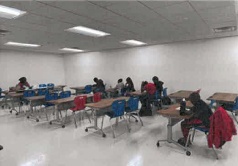 School room of students sitting at desks. 