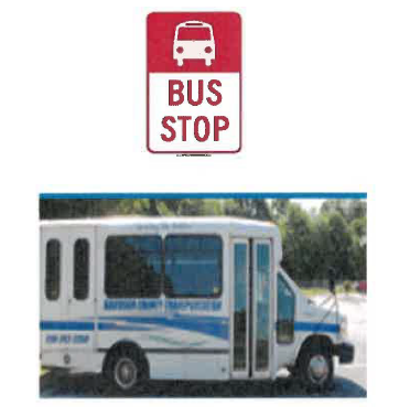 Bus Stop sign with the text, Bus Stop, and a bus parked. 