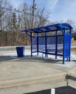 A blue bus shelter.