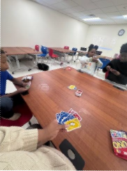 People playing UNO at a table.