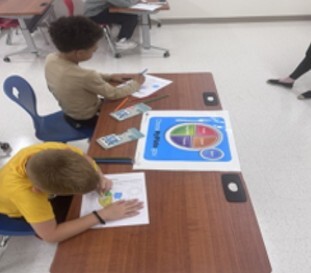 Two boys coloring at a table.